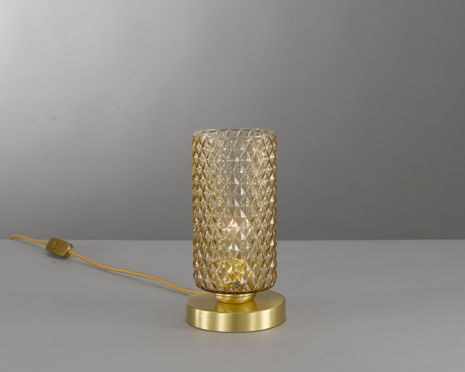 Bedside lamp in brass , satin gold finish, blown glass bronze color. P