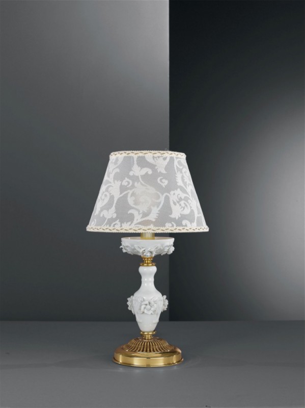Golden brass bedside lamp with white porcelain and lamp shade