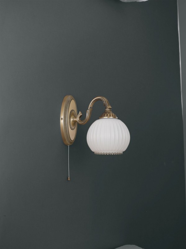 Brass wall sconce with white striped blown glass