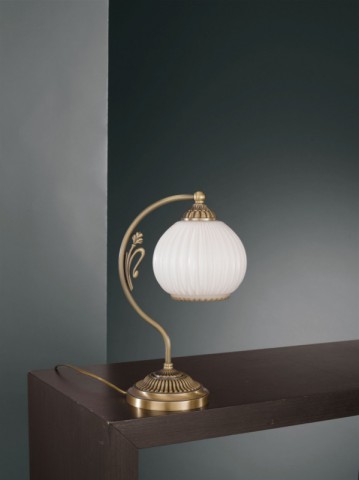 Brass bedside lamp with white striped blown glass