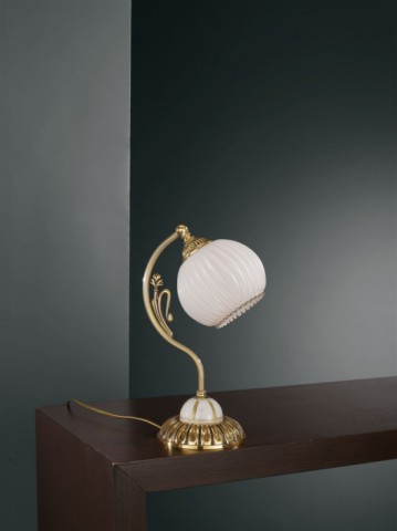 Golden brass bedside lamp with white striped blown glass
