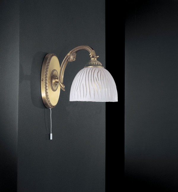 Brass wall sconce with white striped glass