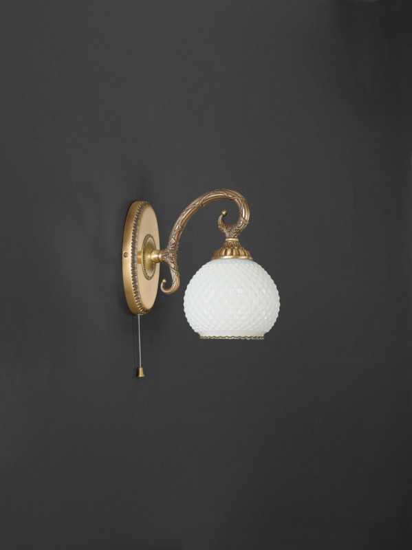 Brass wall sconce with white diamond blown glass