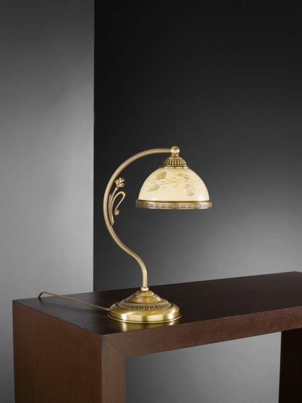 Brass bedside lamp with decorated cream glass