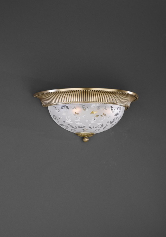 Brass and frosted glass wall sconce with relief decoration