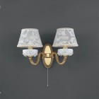 2 light golden brass and white porcelain wall sconce with lamp shade. The lampshade fabric shown in the product photo is no longer available. The lampshades will be shipped with the new fabric as in the second photo.